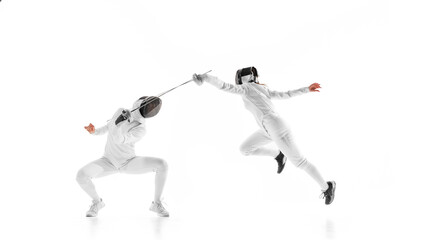 Fencing partners engage in mock duel, focusing on improving their technique and speed against white studio background. Concept of professional sport, competition, strength and power, action. Ad