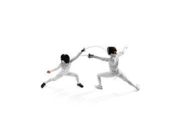 Fototapeta premium Aerial view of two female athletes practicing, during duel to improve their techniques in motion against white studio background. Concept of professional sport, hobby, competition, action. Ad