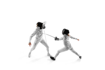 In fencing training session, two female competitors work on their attack and parry sequences...