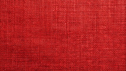 Fototapeta premium Vibrant red linen canvas texture with intricate woven threads, rich scarlet hue, and subtle fabric folds as a detailed background image.