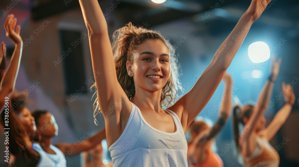 Wall mural A dance fitness class where participants perform energetic moves to upbeat music, celebrating dance as a form of exercise and expression.