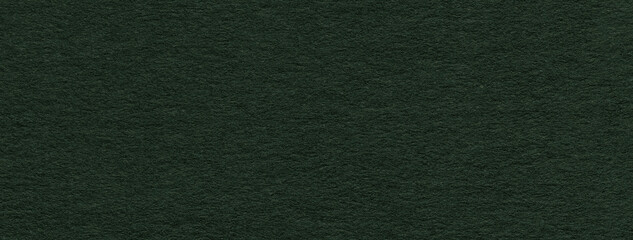 Texture of craft dark green paper background colors, macro. Structure of vintage kraft cardboard.