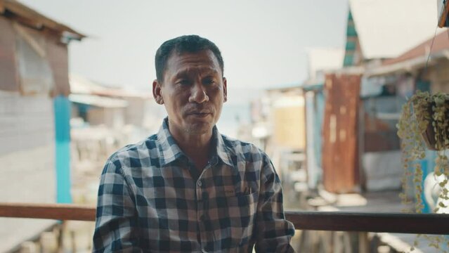 Portrait of the Indonesian man talking during interview, footage has original sound