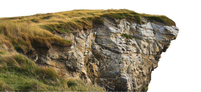 A steep cliff face with grass and rocks in ireland, cut out - stock png.