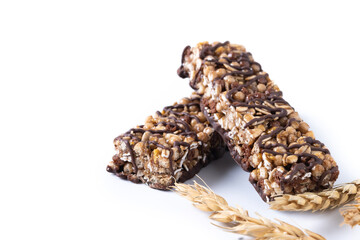 Healthy Muesli bars with nuts and black chocolate isolated on white background. Copy space