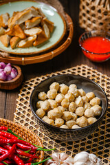 Pentol is a type of snack which can be found in Indonesia. it's a type of beef meatballs with flour, usually given with peanut sauce and sambal.