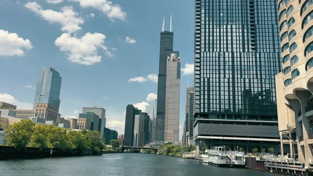 Chicago River with Willis Tower and Modern Architecture, A view of the Chicago River with the Willis Tower and surrounding modern architecture under a clear blue sky