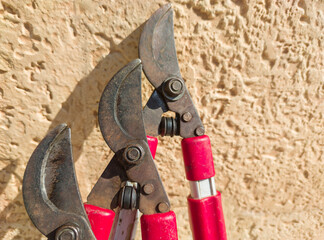 Two-handed shears over rock surface