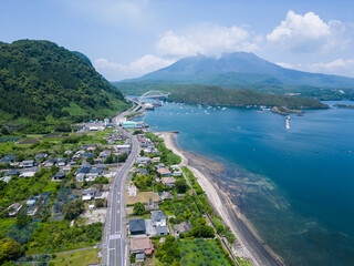 Kagoshima, Japan: Aerial drone view of the coastal road between Kirishima and the Sakurajima...