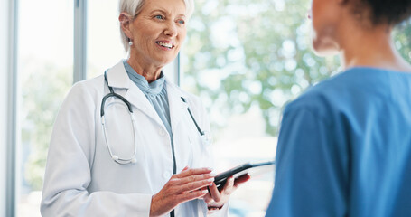 Tablet, conversation and doctor with nurse in hospital for telehealth research in collaboration....