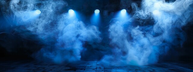 Naklejka premium Blue Smoke and Spotlights on Stage Creating Moody and Dramatic Atmosphere