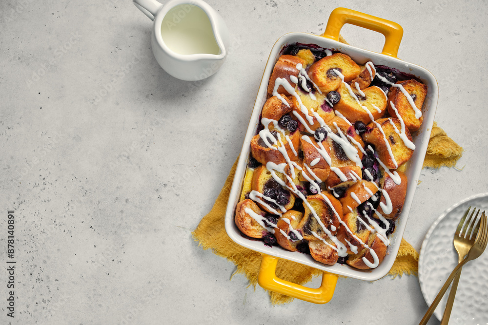 Canvas Prints a yellow dish with a blueberry topping sits on a table