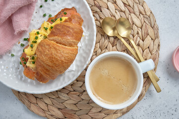 A plate of food with a croissant