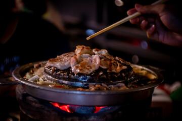 hot pan grill and soup on charcoal stove