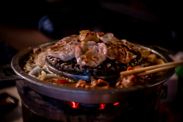 hot pan grill and soup on charcoal stove