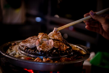 hot pan grill and soup on charcoal stove