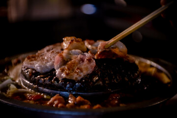 hot pan grill and soup on charcoal stove