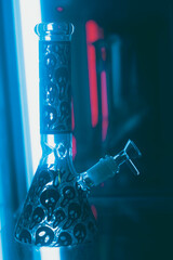 Cannabis Glass bong on black background, space for text. Smoking device