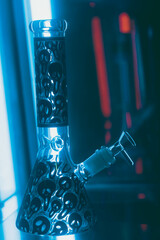 Cannabis Glass bong on black background, space for text. Smoking device