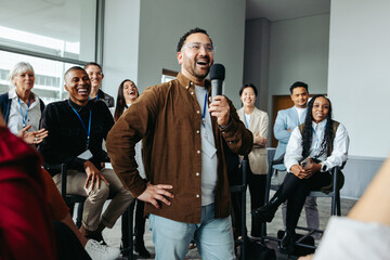 Speaker engaging with audience during business seminar in bright modern conference room