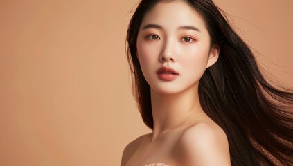 Skin care. Korean Woman with beauty face touching healthy facial skin portrait. Beautiful smiling asian girl model with natural makeup touching glowing hydrated skin on blue background closeup.