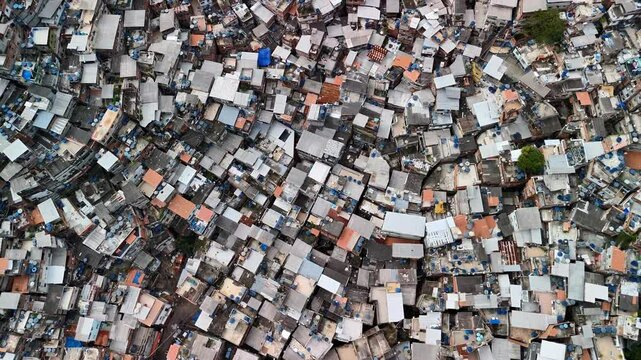 Flyover above Favela Rocinha capturing the colorful homes, bustling activity, and culture of the community.  Rocinha is the largest favela in Brazil.