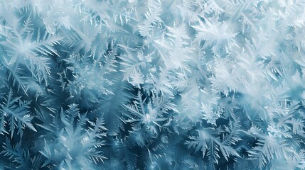 Close-Up of Intricate Frost Patterns on Glass in Cool Blue Tones
