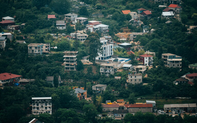 Obraz premium Hillside Residential Area with Diverse Homes.