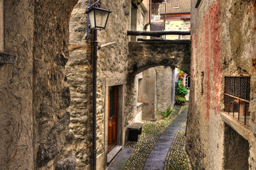 Fototapeta premium Walkway and Old Rustic Houses in City of Ronco sopra Ascona Ticino, Switzerland.