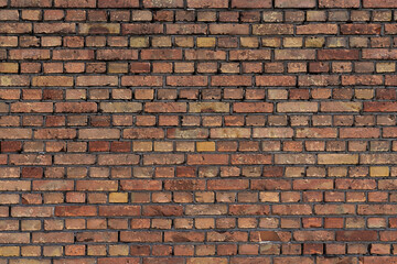 Naklejka premium A close-up of a red brick wall with mortar joints. Horizontal texture.