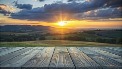 Fototapeta premium Wooden table top with a breathtaking sunset landscape in the background.