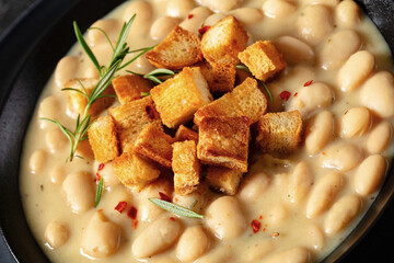 rosemary garlic creamy white bean soup in bowl