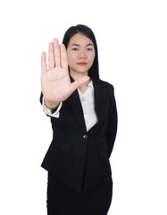 woman wearing professional attire, standing in front of the camera with her hand raised to show 'No' or an open palm gesture