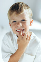 Beautiful child without a tooth. A little boy lost his first tooth.