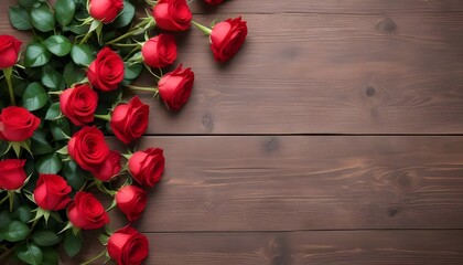 Top view of red roses on wooden table with copy space.