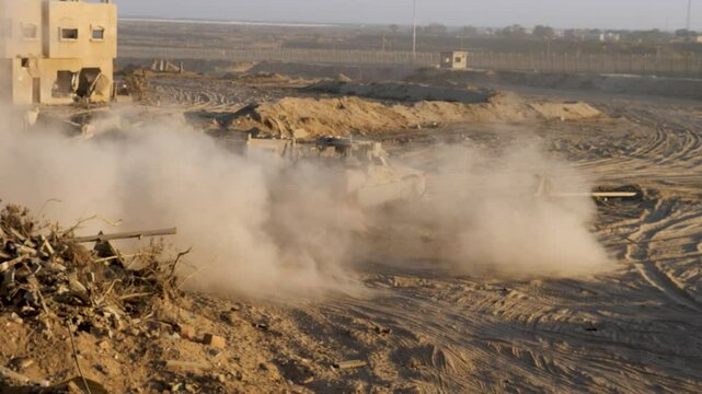 Israeli army vehicles near Egypt to Gaza border in Israel Hamas war conflict