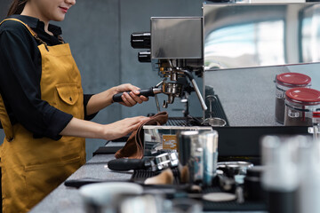 Barista Preparing Espresso with Professional Coffee Machine in Modern Cafe Setting