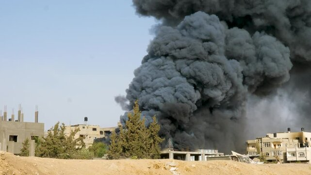 Thick smoke rising after Israeli Air Force attacked a weapon storage place of Hamas during war between Israel and Hamas