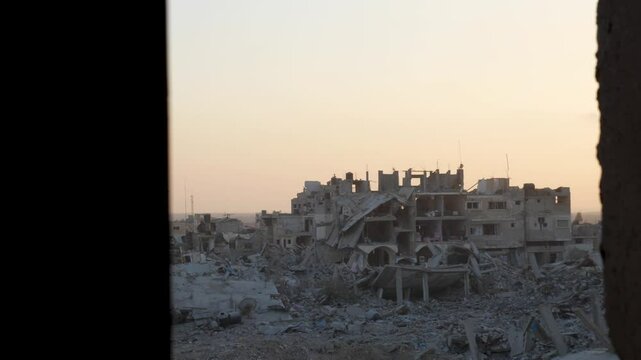 Vandalized residential buildings targeted by Israeli bombardment in the Gaza City town neighbourhood