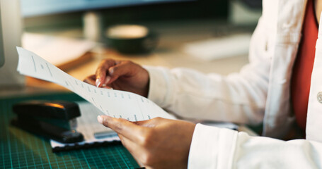 Hands, receipt and paperwork for accounting in home office for reading, review or taxes with remote...