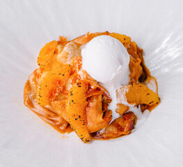 Gourmet pasta with cream sauce and citrus garnish