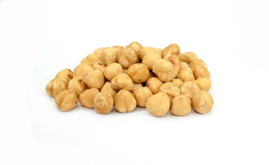 Hazelnut isolated on white background. Pile of peeled roasted hazelnuts isolated on white background. 