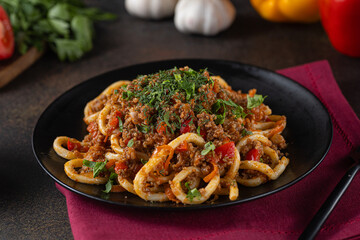 Delicious lagman soup, uzbek lagman soup, Asian cuisine, lagman soup with meat and vegetables. Lagman soup with beef, noodles, sweet peppers, onions and herbs.