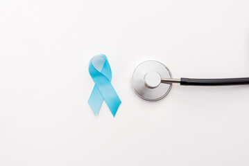 blue ribbon with stethoscope on white background, prostate cancer awareness