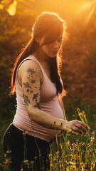 pregnant woman with tattoo waiting for motherhood