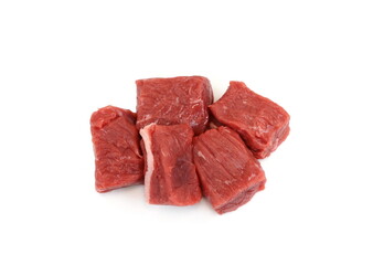 Pile of beef cubes isolated on white. raw diced beef meat ready for goulash. cubes of meat streaked with fat