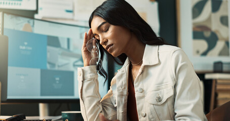 Indian woman, headache and deadline of business, desk and brainstorming for story, journalist and serious. Office, migraine and reporter with stress for news, inspiration and process for media agency