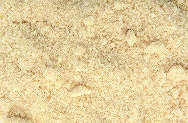 Almond flour texture as a background.
