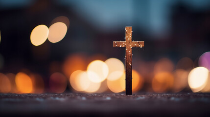 Lone Cross with Sparkling Lights in Urban Night Setting
