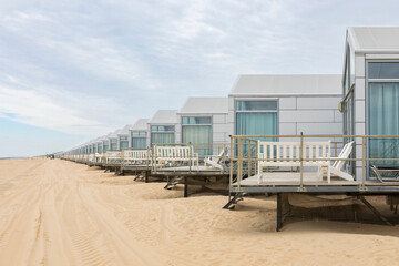 Row of holiday homes on dutch North Sea beach